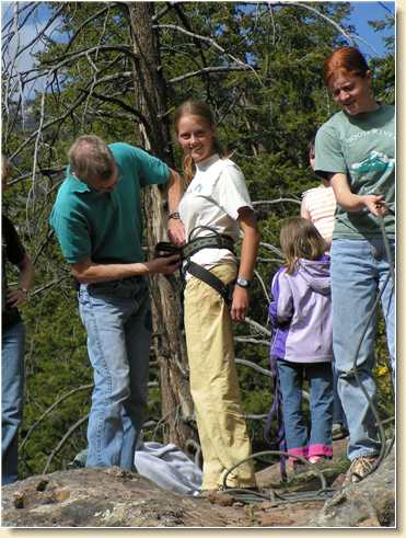 Lezli Sage preparing to rappel