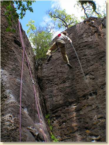 Lezli Sage makes flying leaps on her way down the cliff