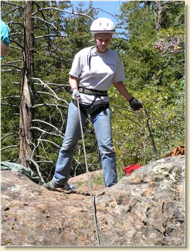 Sarah Ward preparing to rappel face-down