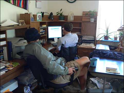 Jim Conrad teaching Fred Adams about web page creation