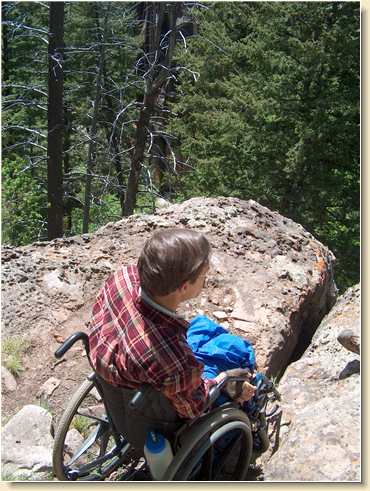 Fred Adams in wheelchair on cliff