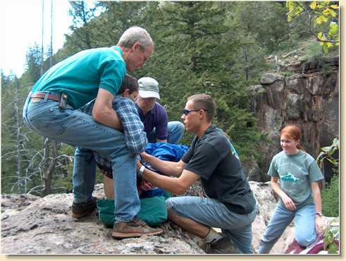 Tom Hunt and Steve Sage hand Fred Adams to Daniel and Heidi