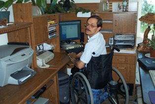 Fred Adams at computer in California