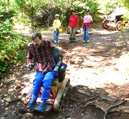 Fred going down creek bank in TracAbout